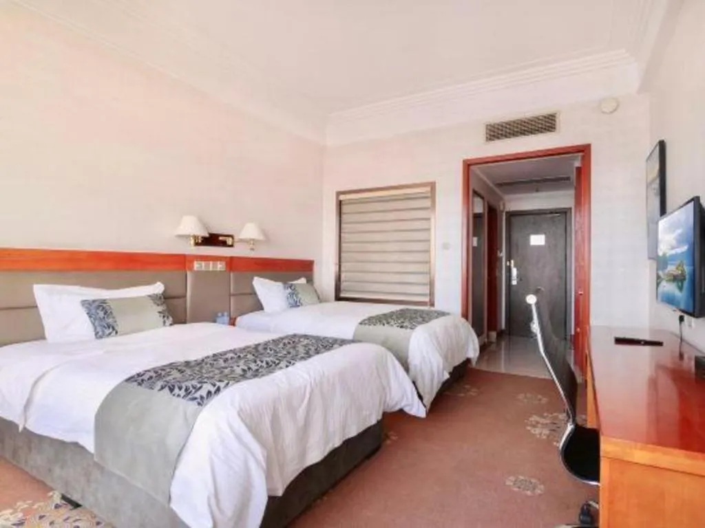 Bed in Dandong Rising Zhonglian Hotel