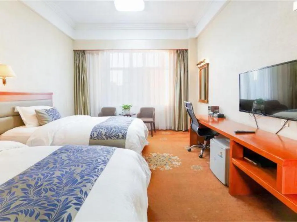 Bed in Dandong Rising Zhonglian Hotel