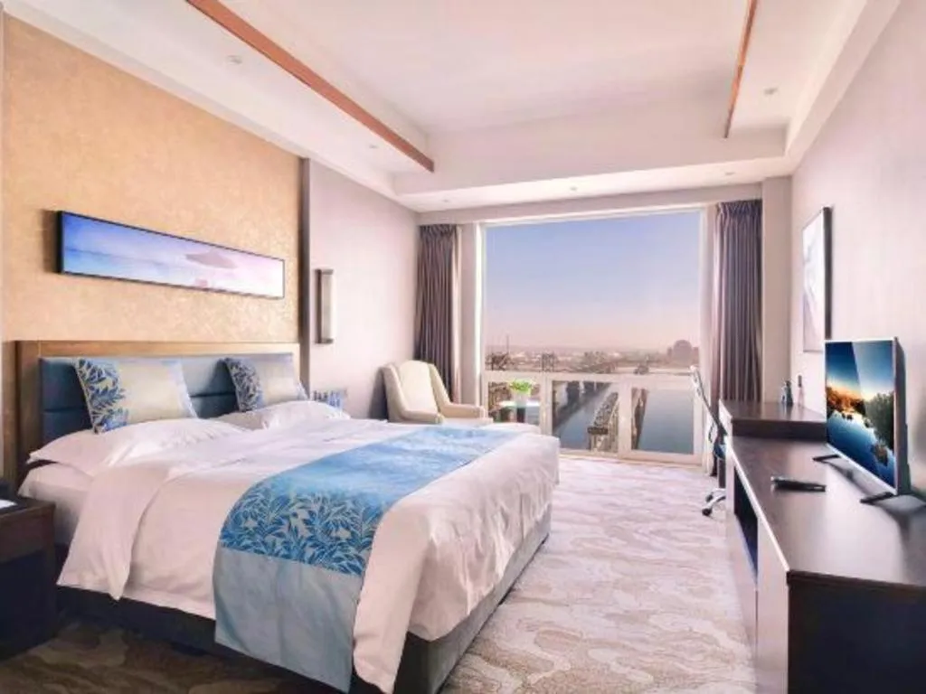 Bed in Dandong Rising Zhonglian Hotel