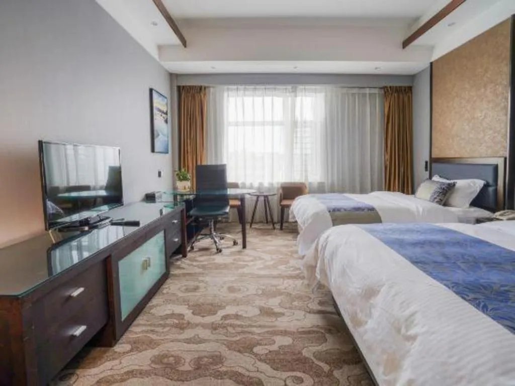Bed in Dandong Rising Zhonglian Hotel