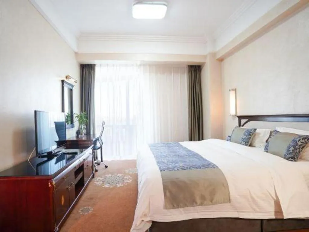 Bed in Dandong Rising Zhonglian Hotel