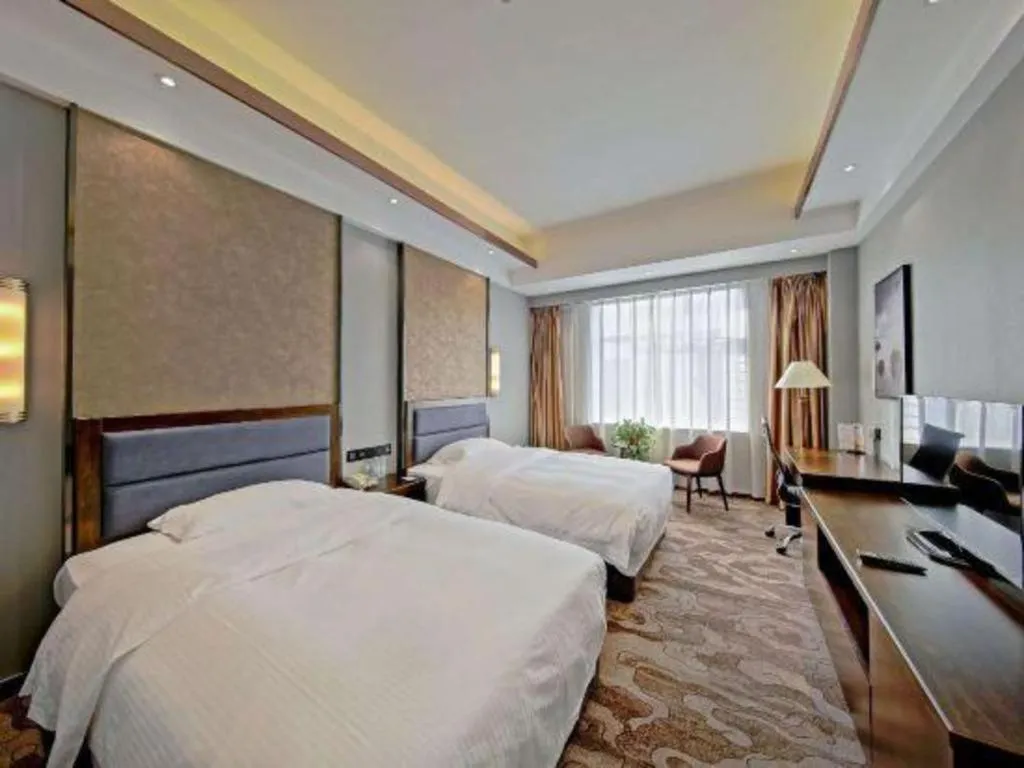 Bed in Dandong Rising Zhonglian Hotel
