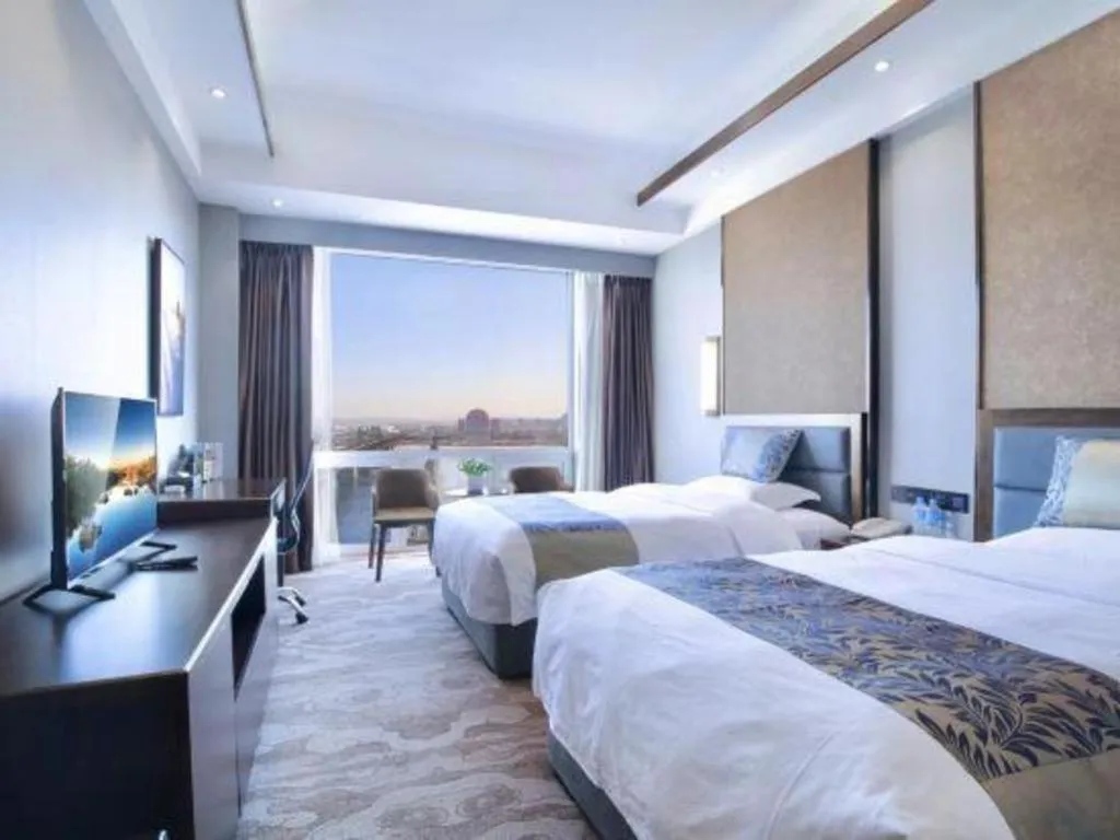 Bed in Dandong Rising Zhonglian Hotel