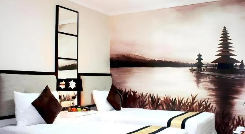 Bed in Amos Cozy Hotel Melawai