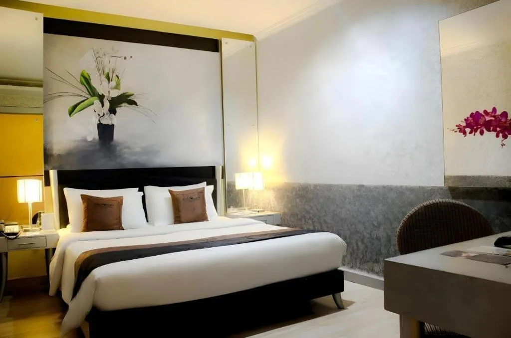 Bed in Amos Cozy Hotel Melawai