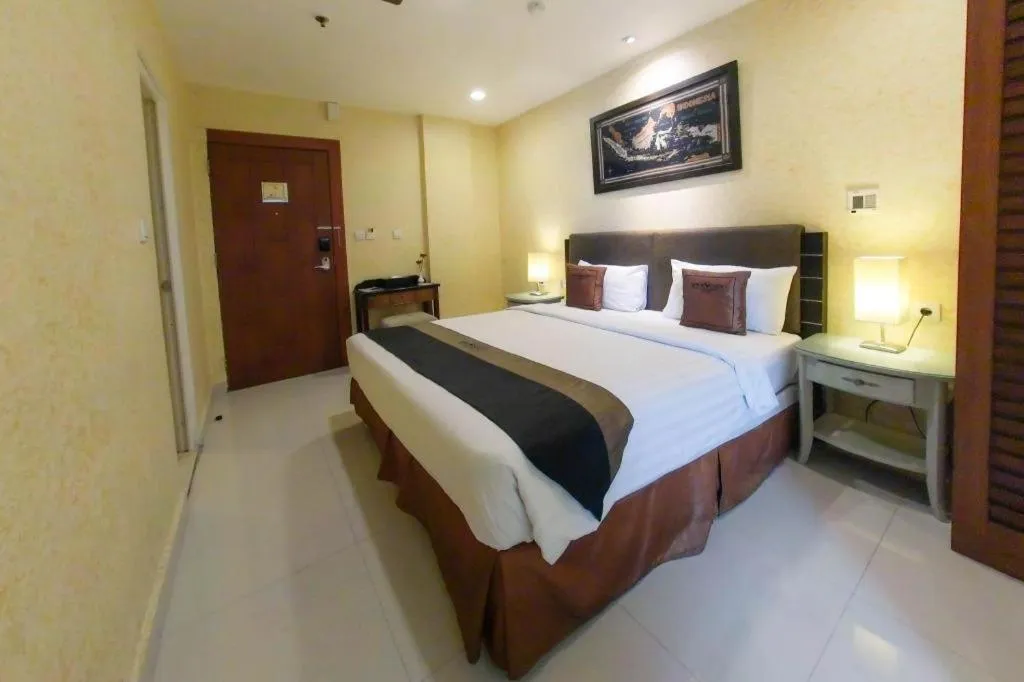 Bed in Amos Cozy Hotel Melawai