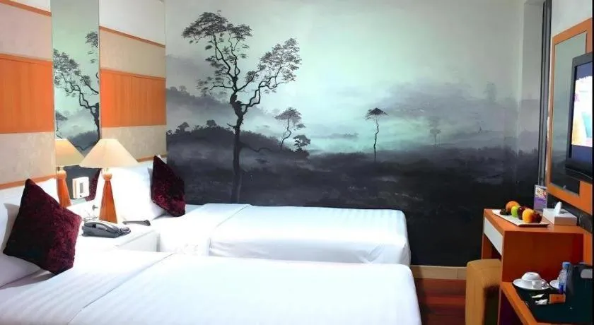 Bed in Amos Cozy Hotel Melawai