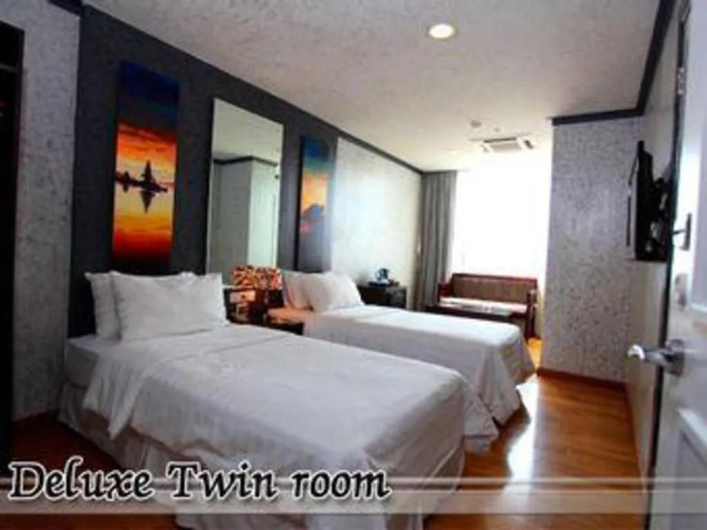 Bed in Amos Cozy Hotel Melawai