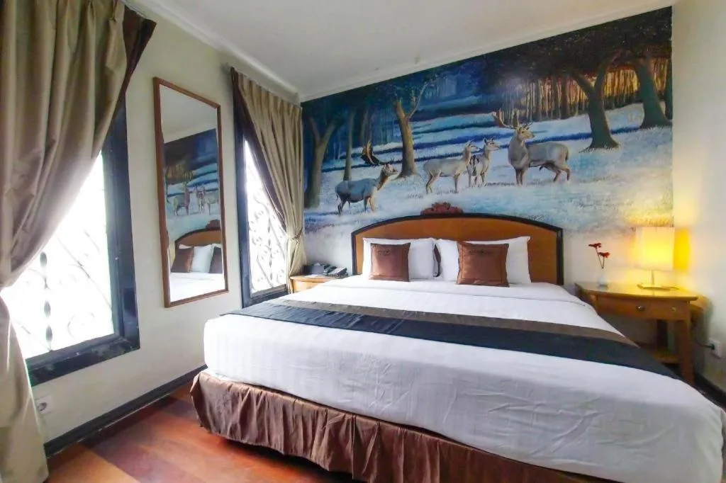 Bed in Amos Cozy Hotel Melawai