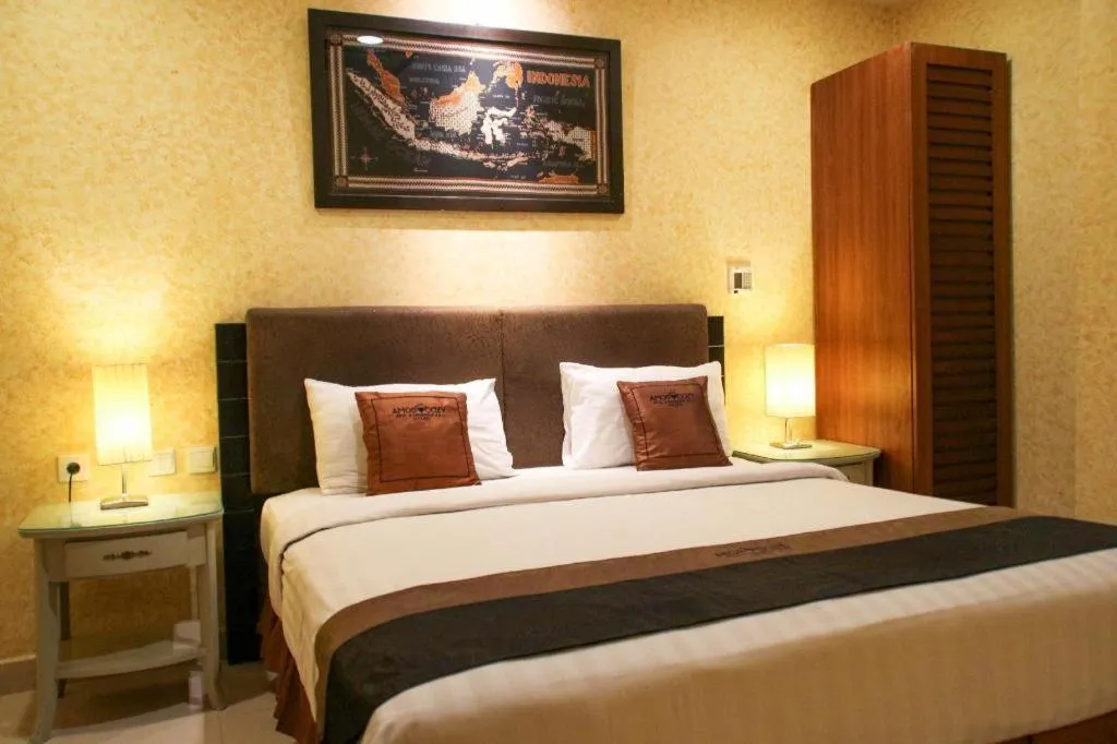 Bed in Amos Cozy Hotel Melawai