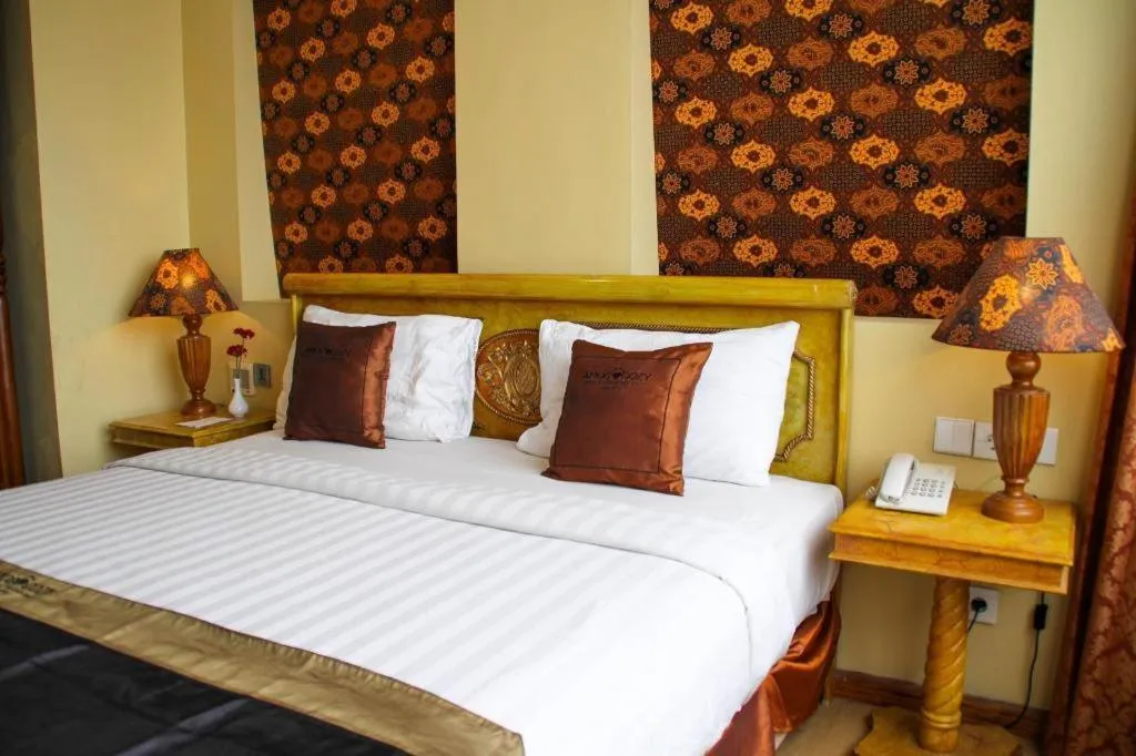 Bed in Amos Cozy Hotel Melawai