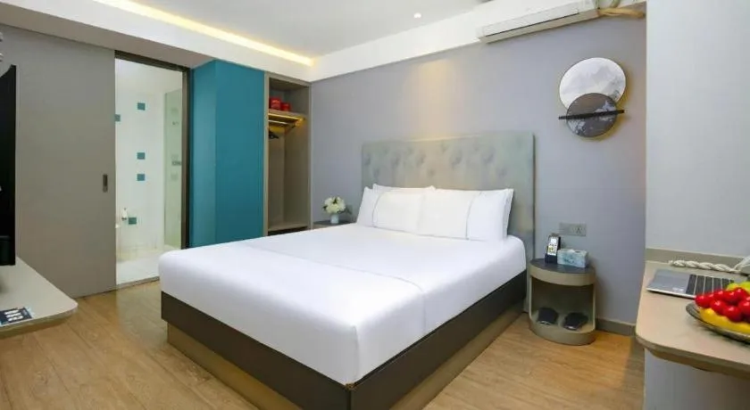 Bed in Magnotel Ningbo Tianyi Plaza Railway Station