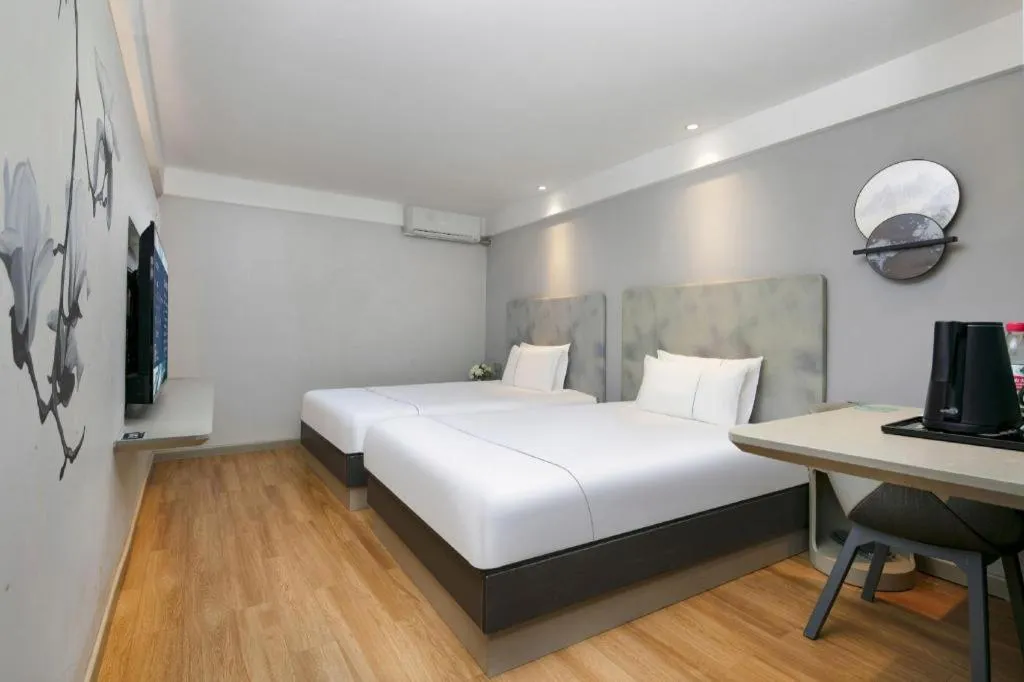 Bed in Magnotel Ningbo Tianyi Plaza Railway Station