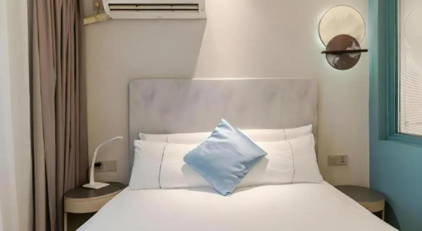 Bed in Magnotel Ningbo Tianyi Plaza Railway Station