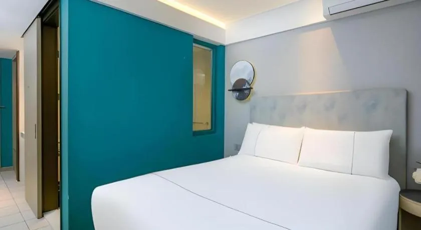 Bed in Magnotel Ningbo Tianyi Plaza Railway Station