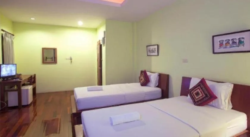 Bed in Baan Lapoon Hotel