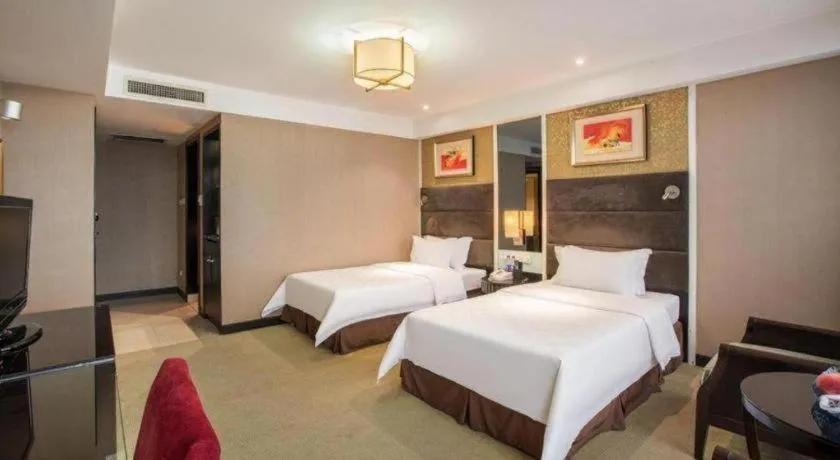 Bed in Zibo Blue Horizon International Hotel