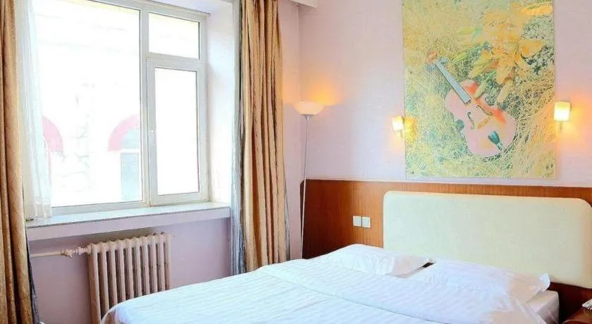 Bed in Super 8 Hotel Beijing International Exhibition Center