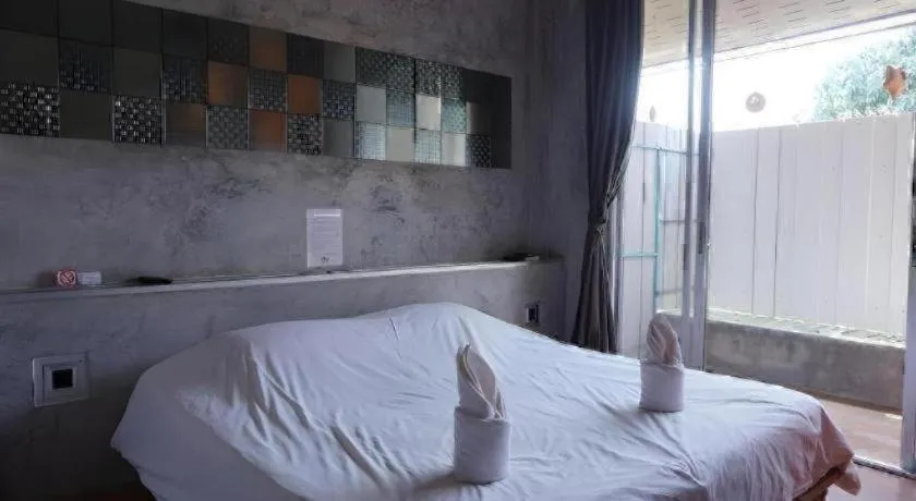 Bed in K-1 Modern Art Hotel @ Nan