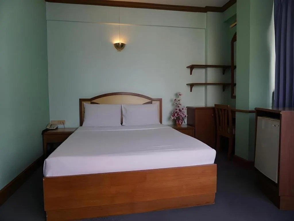 Bed in Tanaphat Hatyai Hotel