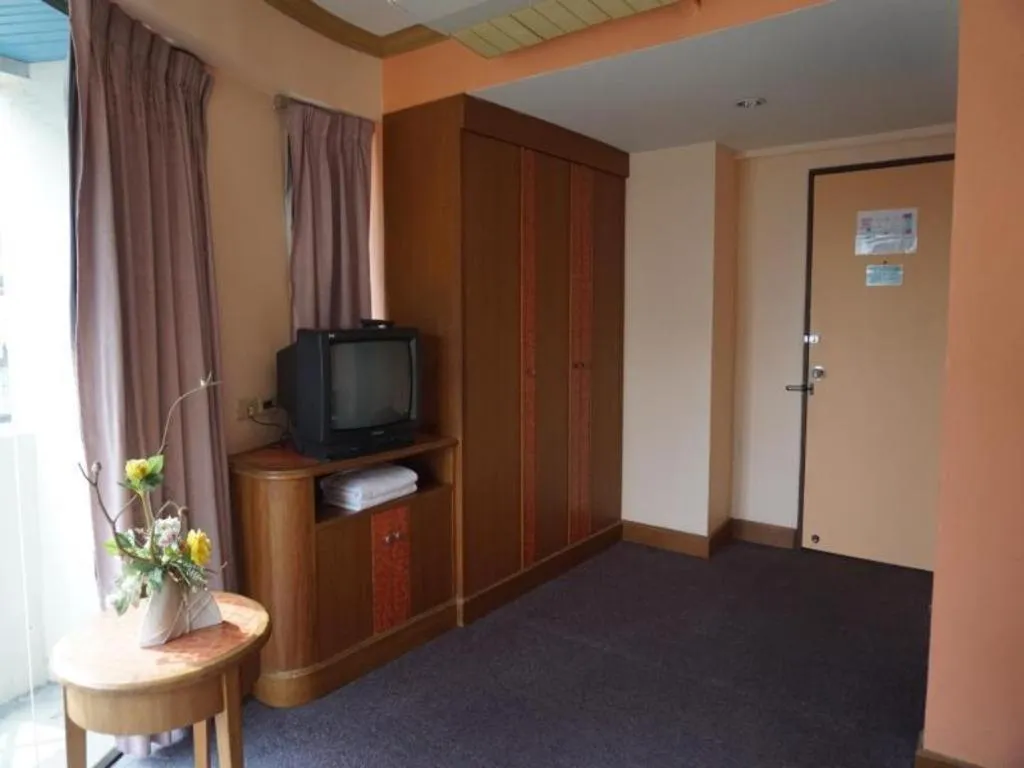 Bed in Tanaphat Hatyai Hotel