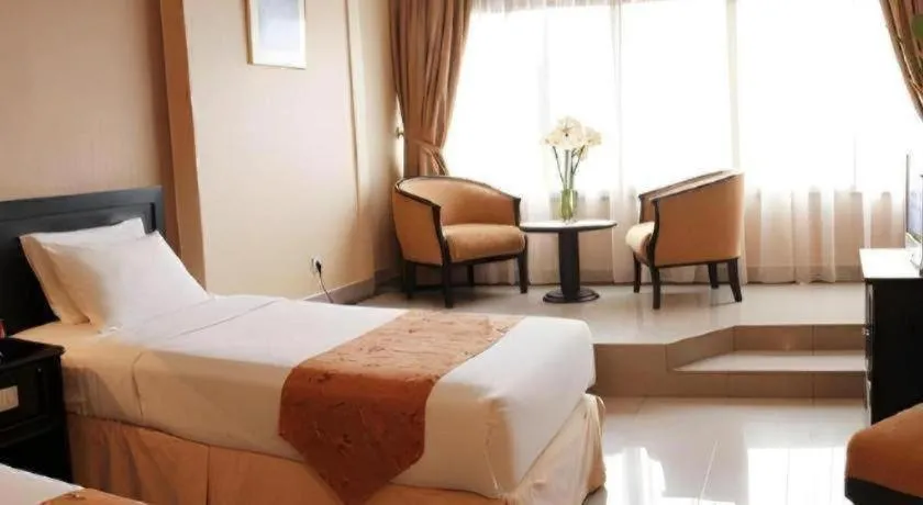 Bed in Danau Toba Hotel International