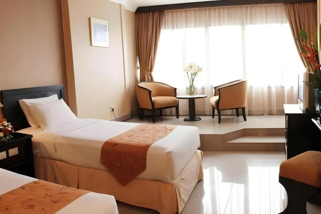 Bed in Danau Toba Hotel International