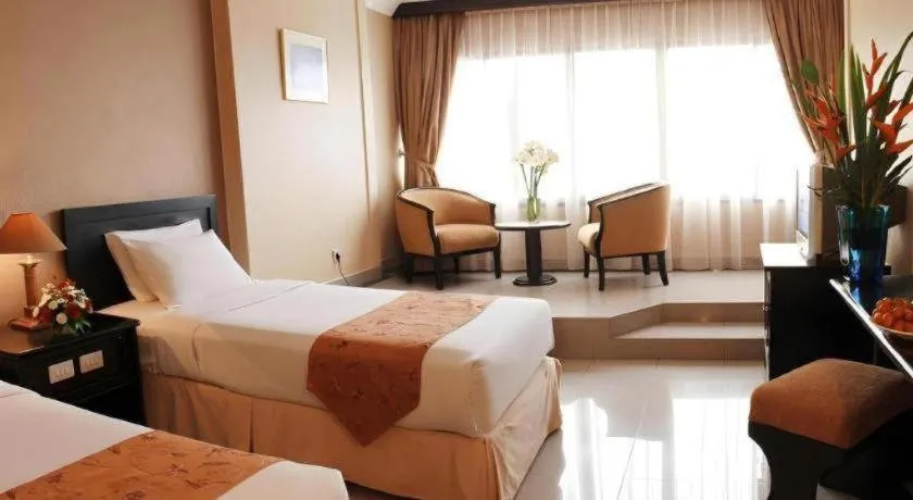 Bed in Danau Toba Hotel International