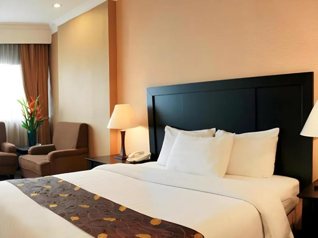 Bed in Danau Toba Hotel International