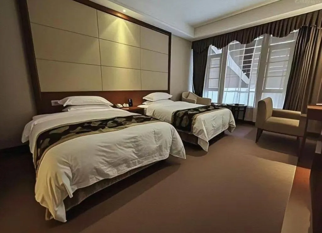 Bed in Jinggangshan ZhongTaiLai International Hotel