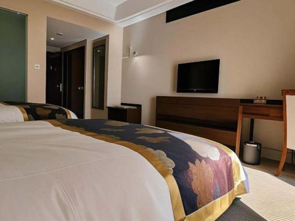 Bed in Jinggangshan ZhongTaiLai International Hotel