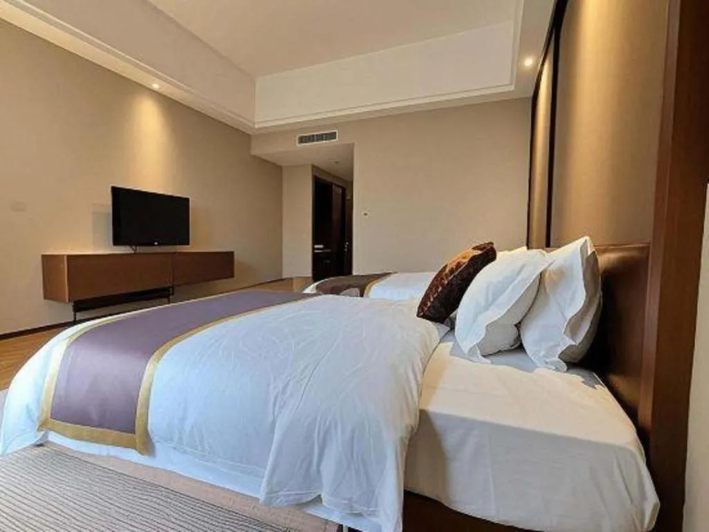 Bed in Jinggangshan ZhongTaiLai International Hotel