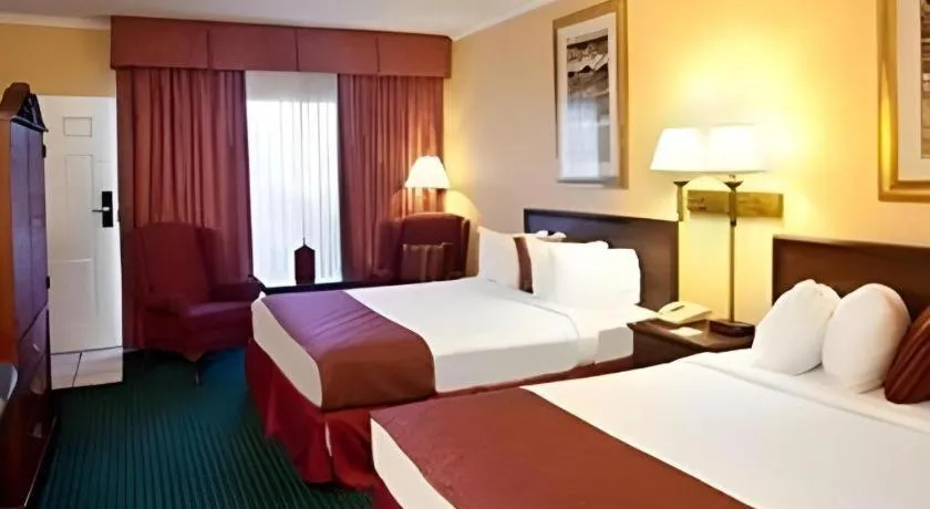 Bed in Magnuson Grand Conference Hotel