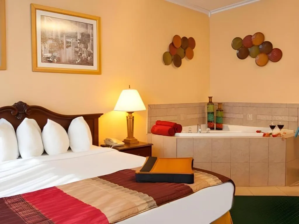 Bed in Magnuson Grand Conference Hotel