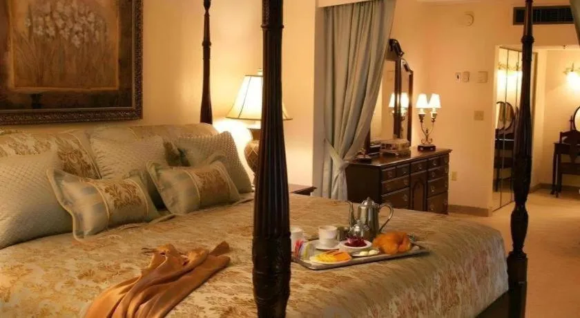 Bed in Magnuson Grand Conference Hotel