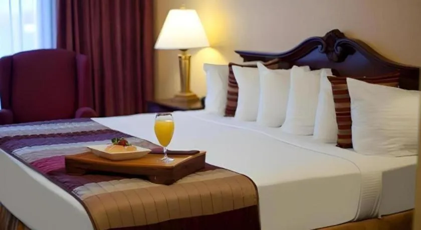 Bed in Magnuson Grand Conference Hotel