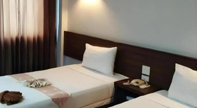 Bed in The Ligor City Hotel