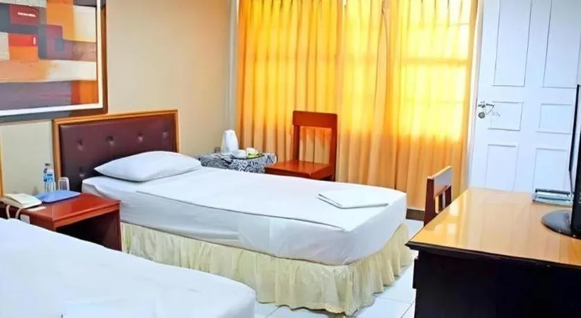 Bed in Hotel Minahasa