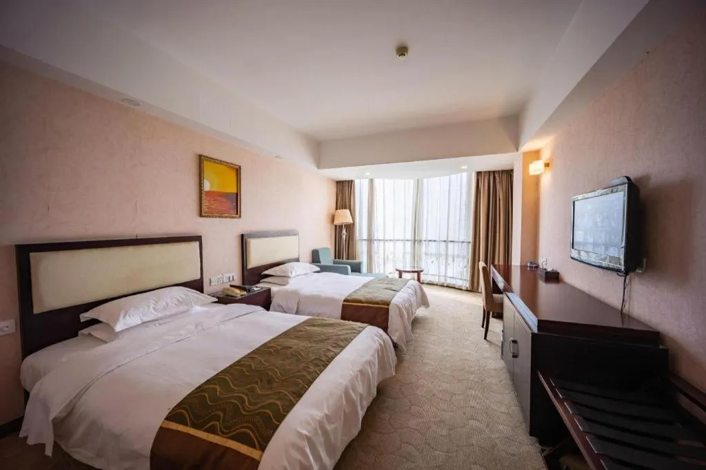 Bed in Wuhan Newport International Hotel