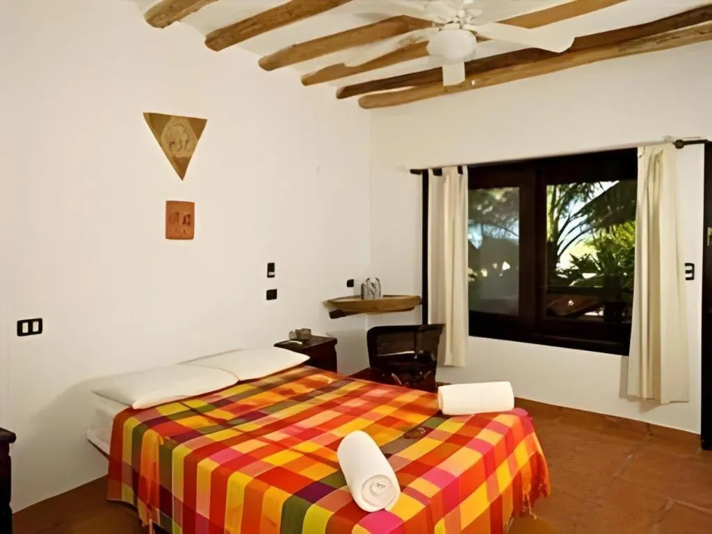 Bed in La Palapa Ethno Chic Hotel