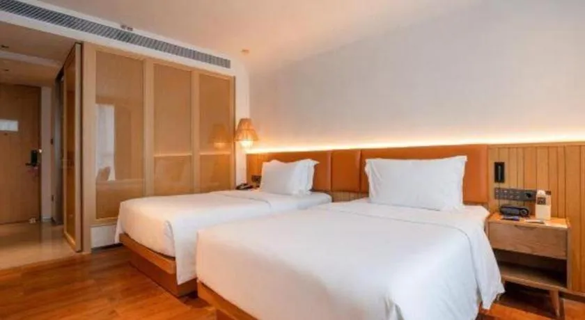 Bed in Dongguan Castfast Hotel