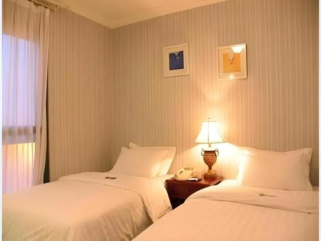 Bed in Dongguan Castfast Hotel