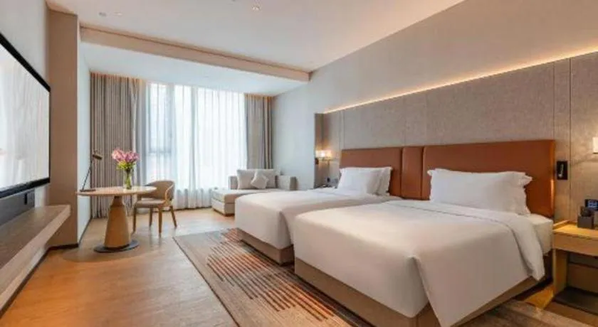 Bed in Dongguan Castfast Hotel