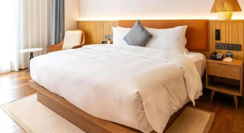 Bed in Dongguan Castfast Hotel