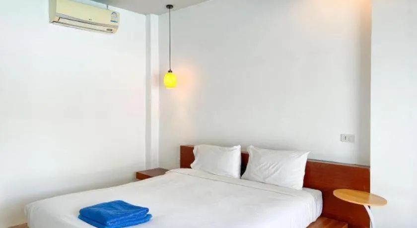 Bed in The Living Pool Villas