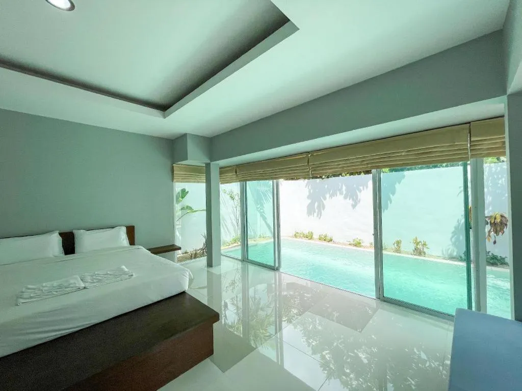 Bed in The Living Pool Villas