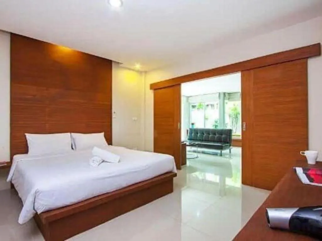 Bed in The Living Pool Villas