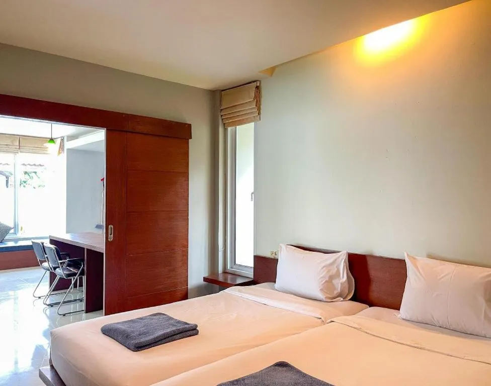 Bed in The Living Pool Villas