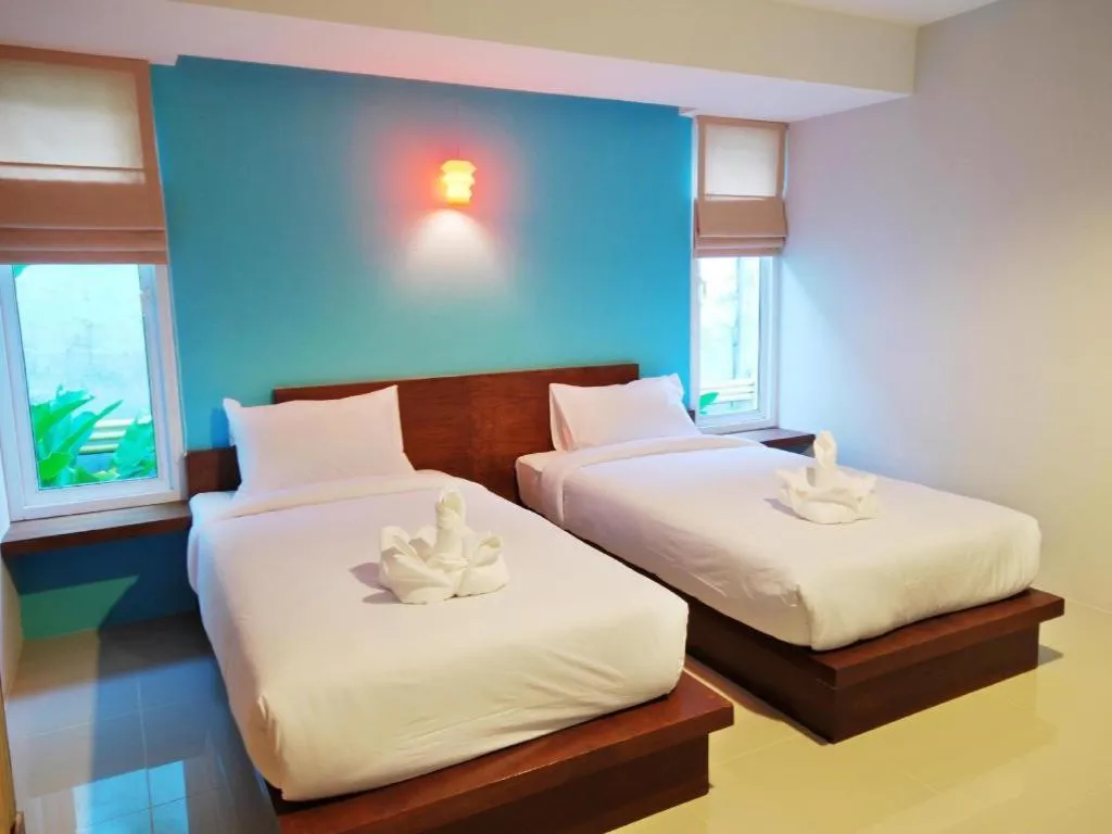 Bed in The Living Pool Villas