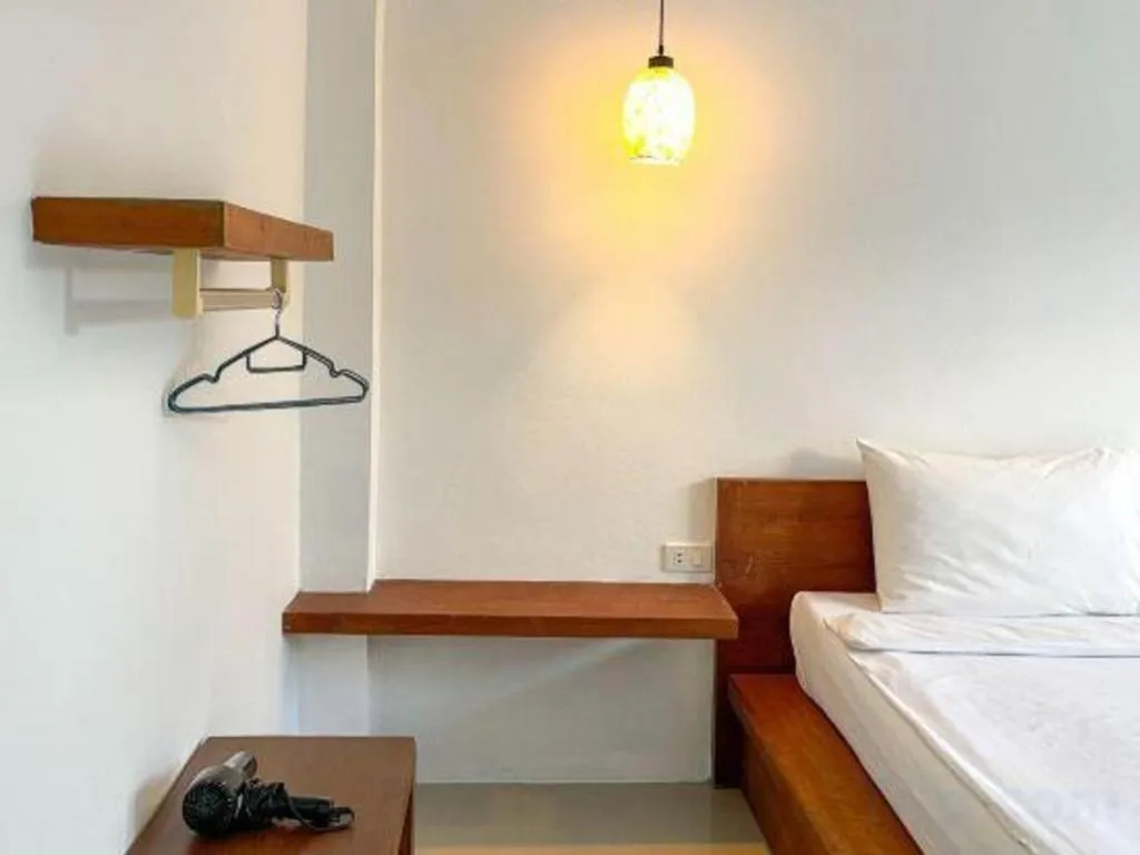 Bed in The Living Pool Villas